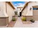 Elegant entryway with decorative pavers leading to a cozy seating area and the welcoming front door at 20256 E Canary Ct, Queen Creek, AZ 85142