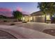 Well-maintained home with a spacious driveway and manicured landscaping, exuding suburban elegance at 20256 E Canary Ct, Queen Creek, AZ 85142