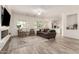 Living room with windows, electric fireplace and modern furniture at 20256 E Canary Ct, Queen Creek, AZ 85142