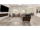 Open floor plan living room with view to kitchen and dining area at 20256 E Canary Ct, Queen Creek, AZ 85142