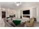 Spacious living room with electric fireplace and view to dining room at 20256 E Canary Ct, Queen Creek, AZ 85142
