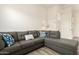 Inviting living room featuring a large sectional sofa and neutral decor at 20256 E Canary Ct, Queen Creek, AZ 85142