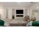 Open floor plan in this living room with electric fireplace and modern finishes at 20256 E Canary Ct, Queen Creek, AZ 85142