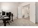 Home office setup with modern technology and an adjacent doorway to the bathroom at 20256 E Canary Ct, Queen Creek, AZ 85142