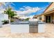 Outdoor kitchen featuring stainless grill, sink, and counter space at 20256 E Canary Ct, Queen Creek, AZ 85142