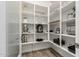Walk-in pantry with ample shelving and storage for all your kitchen needs at 20256 E Canary Ct, Queen Creek, AZ 85142