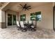 Relaxing outdoor patio with ceiling fan and dining table for Gathering gatherings at 20256 E Canary Ct, Queen Creek, AZ 85142