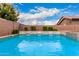 Gorgeous pool featuring a rock waterfall in a private backyard setting at 20256 E Canary Ct, Queen Creek, AZ 85142
