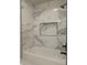 Bathroom with large bathtub with showerhead and soap inset at 20677 N 16Th Way, Phoenix, AZ 85024