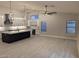 Open floor plan with large quartz island and modern gray paint at 20677 N 16Th Way, Phoenix, AZ 85024