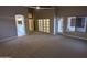 Neutral main bedroom with vaulted ceiling, plush carpeting, and access to main bathroom at 20677 N 16Th Way, Phoenix, AZ 85024