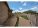 Side yard with shed, brick pavers, gravel, and artificial grass at 2222 E Gretta Pl, Phoenix, AZ 85022
