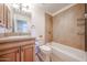 Bathroom featuring tiled shower over tub and updated vanity at 2222 E Gretta Pl, Phoenix, AZ 85022