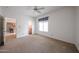 Bedroom featuring plush carpet and natural light from a large window at 2222 E Gretta Pl, Phoenix, AZ 85022