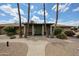 Community clubhouse featuring palm trees, desert landscaping, and a welcoming entrance at 2222 E Gretta Pl, Phoenix, AZ 85022