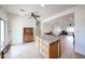 Open-concept kitchen with granite countertops, breakfast bar, adjacent to the dining and living areas at 2222 E Gretta Pl, Phoenix, AZ 85022