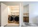 Convenient laundry area equipped with modern washer and dryer units, sink and additional storage at 2222 E Gretta Pl, Phoenix, AZ 85022