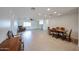 Open-concept living and dining area with neutral tile and natural light at 2222 E Gretta Pl, Phoenix, AZ 85022