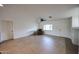 Spacious living room with neutral tile flooring, ceiling fan and abundant natural light at 2222 E Gretta Pl, Phoenix, AZ 85022