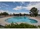 Community pool featuring a large pool, blue skies and trees at 2222 E Gretta Pl, Phoenix, AZ 85022