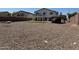 Expansive backyard featuring rock landscaping, a gazebo, and a small patch of green grass at 22966 W Hopi St, Buckeye, AZ 85326