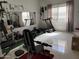 Home workout room with weightlifting equipment, treadmill, mirror, and natural light at 22966 W Hopi St, Buckeye, AZ 85326