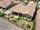 Aerial view showcasing the tile roof, covered patio, garden area, and desert landscaping at 28375 N 130Th Dr, Peoria, AZ 85383