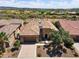 Aerial view of desert home showing mature landscaping, a three car garage, and an inviting neighborhood at 28375 N 130Th Dr, Peoria, AZ 85383