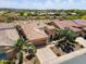 Aerial view of desert home showing tile roof, desert landscaping, three car garage, and inviting neighborhood at 28375 N 130Th Dr, Peoria, AZ 85383