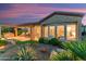 Spacious backyard boasting desert landscaping, a covered patio, and a built-in grill, perfect for outdoor entertaining at 28375 N 130Th Dr, Peoria, AZ 85383