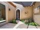 Charming courtyard featuring a decorative gate, artificial turf, and stylish wall decor at 28375 N 130Th Dr, Peoria, AZ 85383