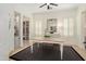 An inviting dining room with a table for four and natural light through white framed windows at 28375 N 130Th Dr, Peoria, AZ 85383
