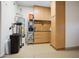 Well-organized garage area featuring built-in cabinets, utility shelves, and ample storage space for household items at 28375 N 130Th Dr, Peoria, AZ 85383