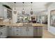 Stylish kitchen with a view to the dining and living area offers a seamless flow for modern living and entertaining at 28375 N 130Th Dr, Peoria, AZ 85383