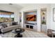 Cozy living room features built-in entertainment center, desert view, and comfortable seating for relaxation and enjoyment at 28375 N 130Th Dr, Peoria, AZ 85383