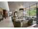 Open lounge area featuring comfortable seating and large windows, creating a bright and welcoming space at 28375 N 130Th Dr, Peoria, AZ 85383