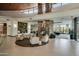 Inviting lounge area with comfortable seating, stone fireplace and decor for relaxation and socializing at 28375 N 130Th Dr, Peoria, AZ 85383