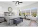Bright and sunny main bedroom featuring large windows and a cozy sitting area at 28375 N 130Th Dr, Peoria, AZ 85383
