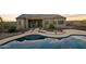 Inviting backyard pool and patio area, ideal for relaxing and entertaining in this desert home at 300 W Quartz Rock Rd, Phoenix, AZ 85085