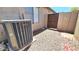 Backyard with gravel ground cover, block wall, and AC unit at 3002 W Caravaggio Ln, Phoenix, AZ 85086