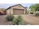 Inviting home with a two-car garage and desert landscaping along a brick driveway at 3002 W Caravaggio Ln, Phoenix, AZ 85086
