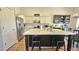 Modern kitchen featuring a large island, stainless steel appliances, and white cabinets at 3002 W Caravaggio Ln, Phoenix, AZ 85086