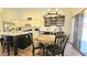 Bright kitchen and breakfast nook with a large island, stainless steel appliances, and dining table at 3002 W Caravaggio Ln, Phoenix, AZ 85086