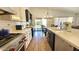 Bright kitchen featuring stainless appliances, white cabinets, and a view to the back yard at 3002 W Caravaggio Ln, Phoenix, AZ 85086