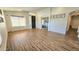 Spacious living room with hardwood floors and abundant natural light from a large window at 3002 W Caravaggio Ln, Phoenix, AZ 85086