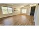 Bright, open living room featuring hardwood floors, white walls, and lots of natural light at 3002 W Caravaggio Ln, Phoenix, AZ 85086