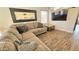 Cozy living room with comfortable seating, a large mirror, and a television at 3002 W Caravaggio Ln, Phoenix, AZ 85086