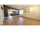 Spacious living room with wood-look flooring and plenty of natural light at 3002 W Caravaggio Ln, Phoenix, AZ 85086