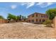 Large backyard with dirt and rock landscaping, offering a blank canvas for customization at 304 E Beth Dr, Phoenix, AZ 85042