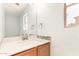 Bathroom featuring a single sink vanity with a white countertop and gray backsplash at 304 E Beth Dr, Phoenix, AZ 85042